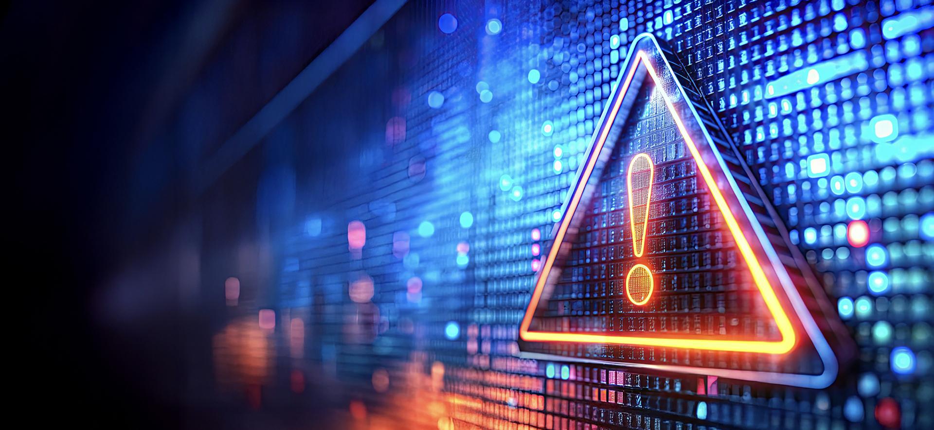 trójkąt z wykrzyknikiem w środku na tle cyfrowych sześcianów ułożonych na pionowej płaszczyźnie