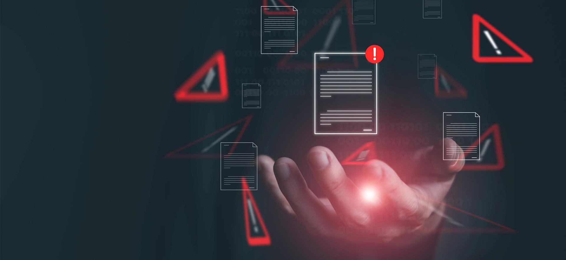 w centralnym miejscu jest dłoń, która świeci się na czerwono, a wokół niej unosą się ikony dokumentów i wykrzykniki w trójkątach