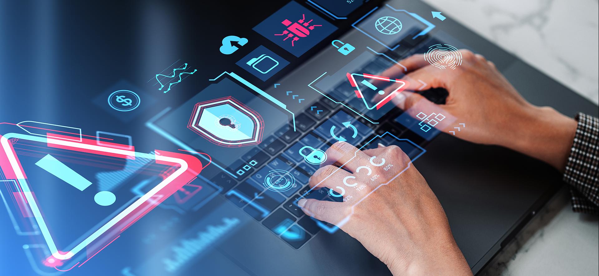 ręce na klawiaturze i różne kolorowe ikony umieszczone w płaszczyźnie klawiatury