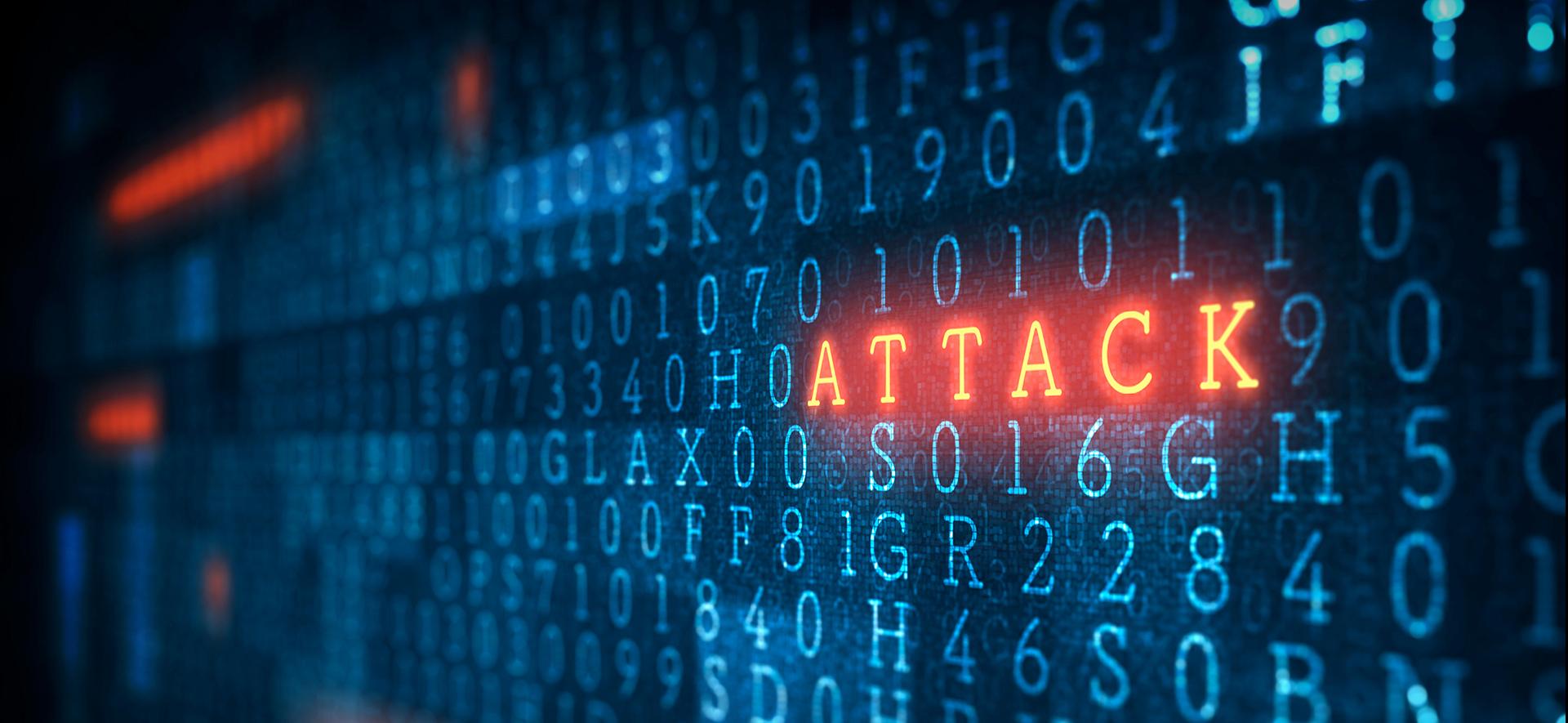 czerwony neonowy napis attack na ekranie wyświetlającym  niebieskie różne litery i cyfry 