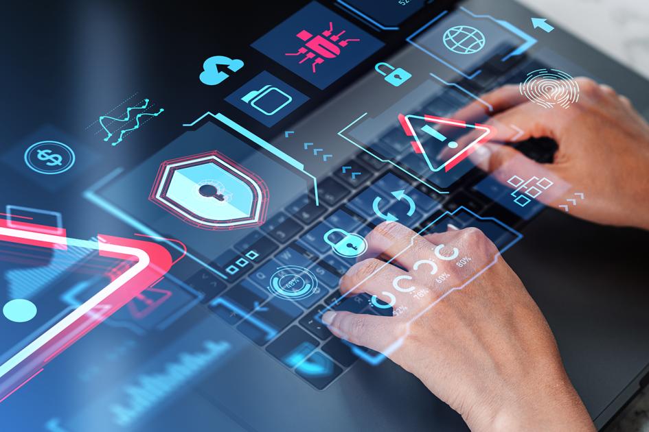 ręce na klawiaturze i różne kolorowe ikony umieszczone w płaszczyźnie klawiatury